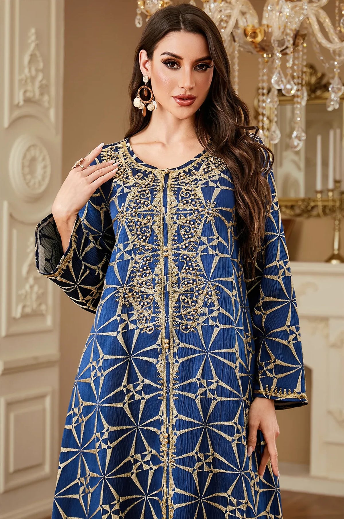 Waist-up close-up of the intricate gold embroidery and beaded neckline on the Selas Blue textured kaftan.