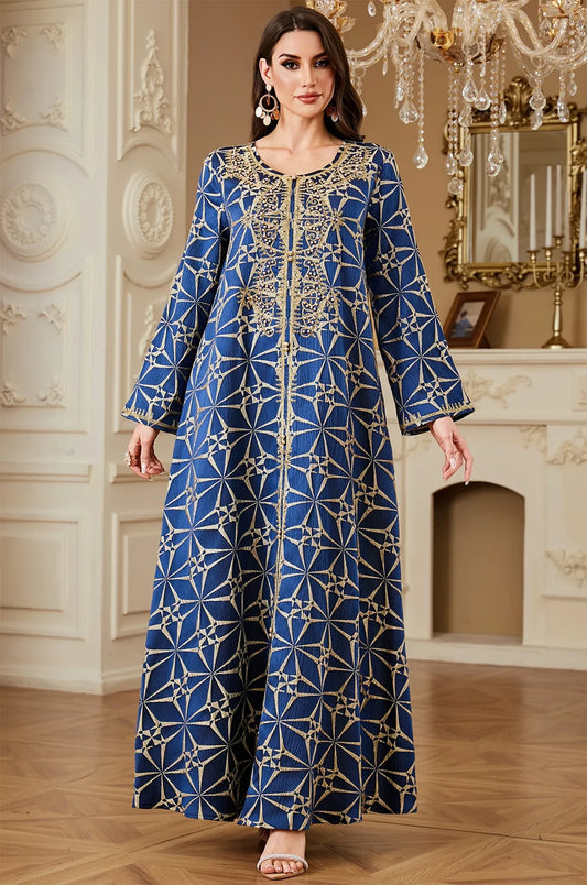 Full front shot of the Selas Blue textured kaftan dress standing in an ornate room with white wall paneling.