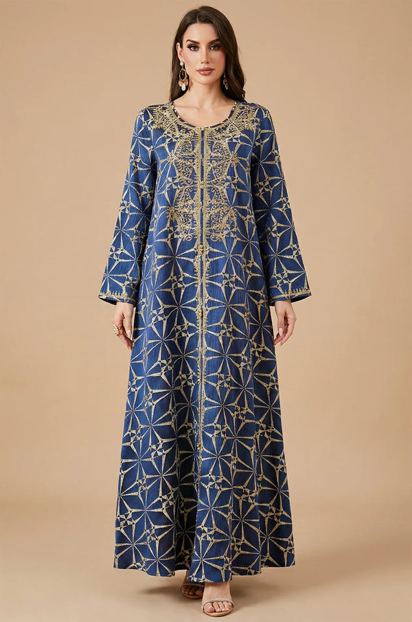 Full front view of the Selas Royal Blue textured kaftan dress with gold embroidery on a tan studio background.