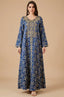 Full front view of the Selas Royal Blue textured kaftan dress with gold embroidery on a tan studio background.
