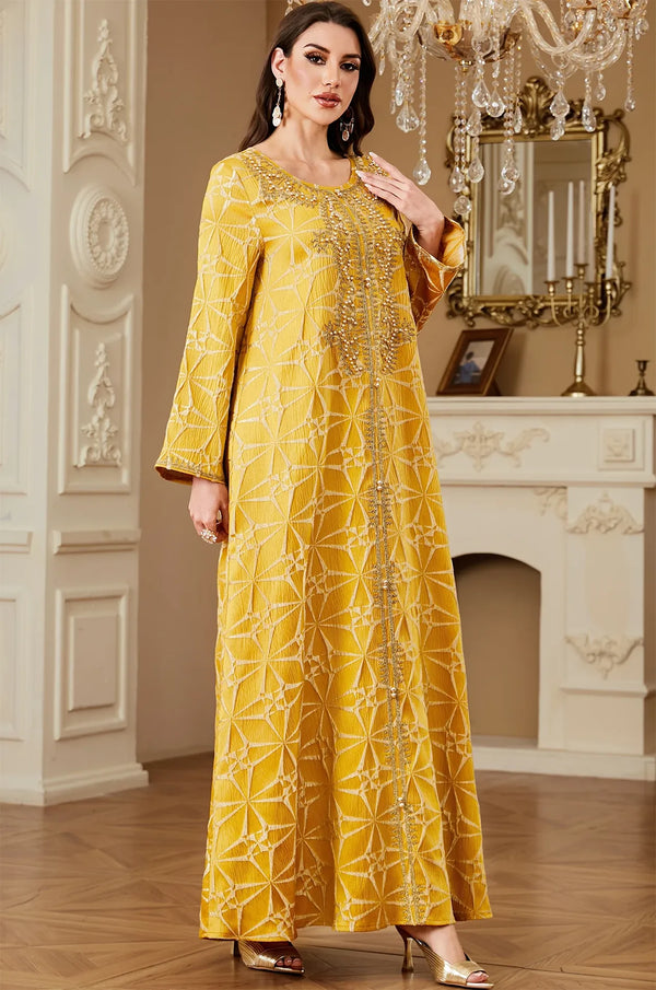Side view of the Selas Yellow textured kaftan dress showing the elegant movement of the A-line silhouette.
