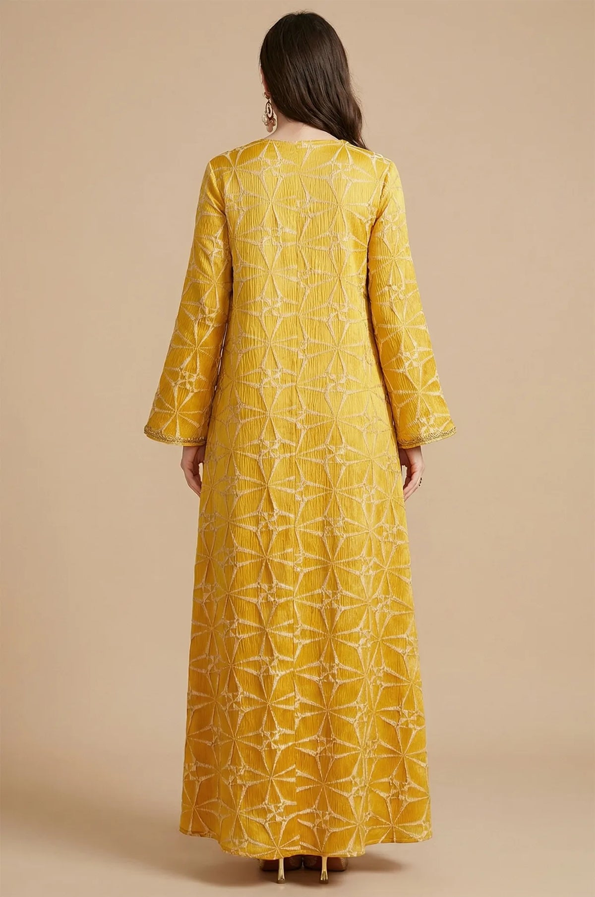 Full back view of the Selas Yellow textured kaftan dress showing the continuous geometric starburst pattern.