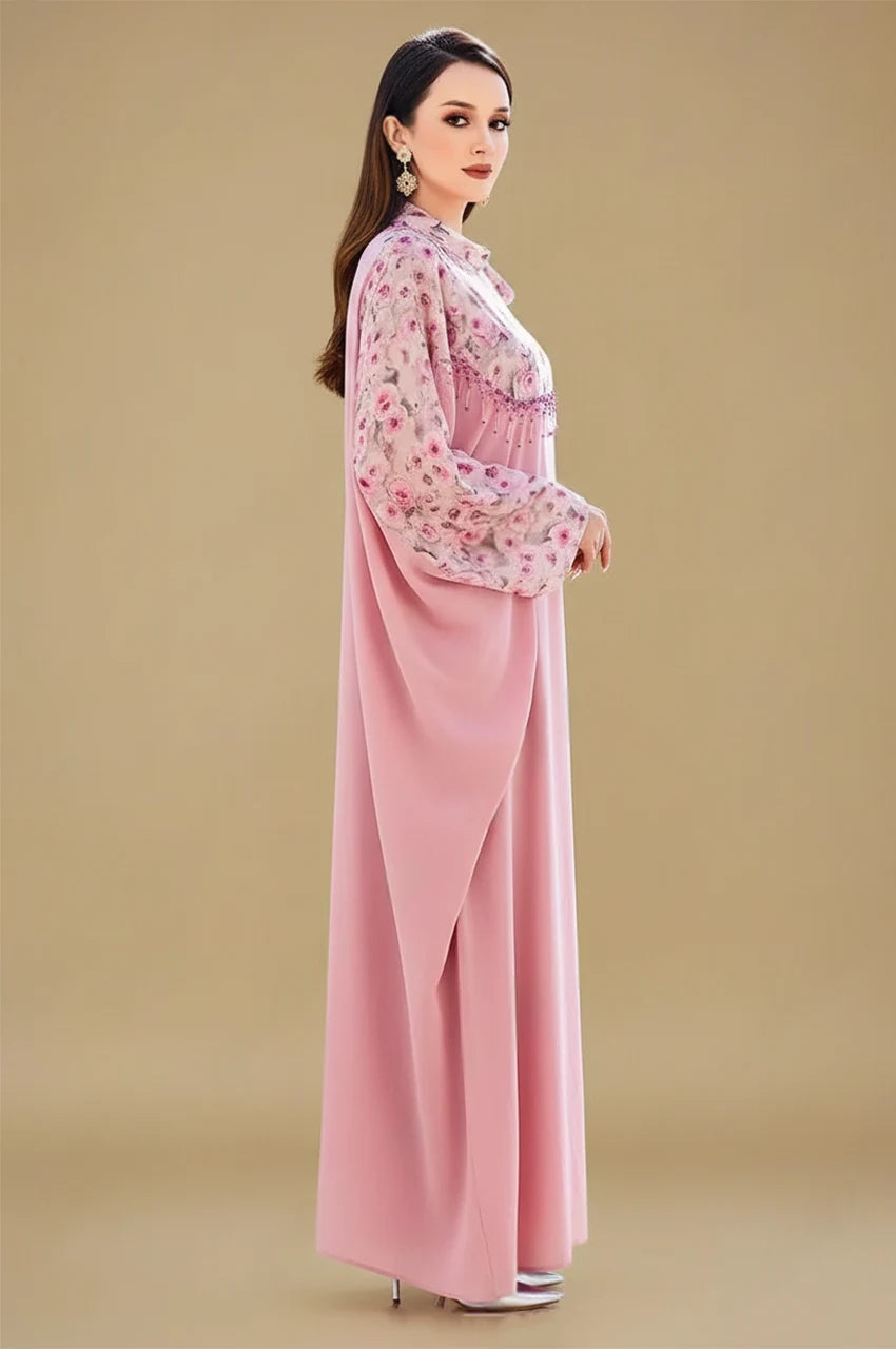 Side view of Selena pink beaded kaftan with floral chiffon overlay and cape sleeves