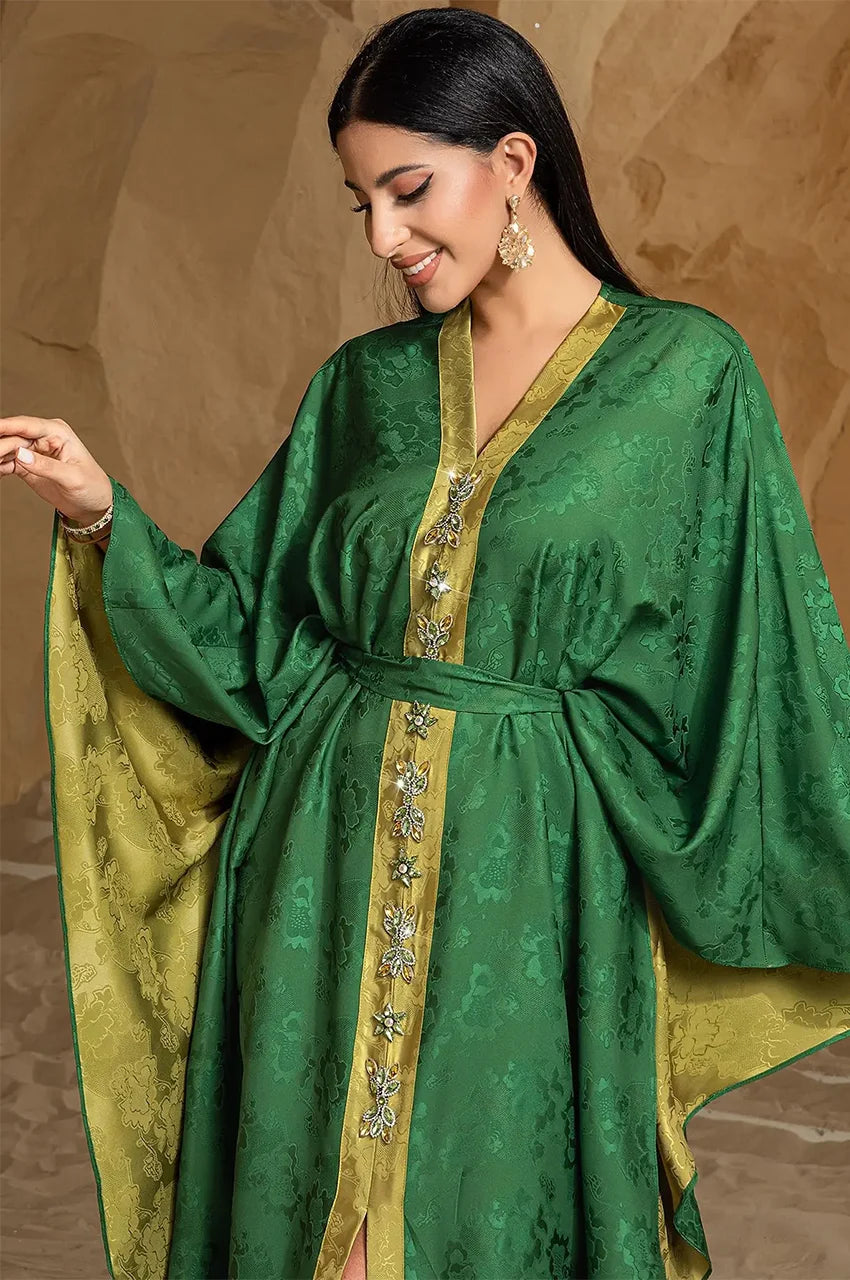 Three-quarter view of Selora green embellished silk kaftan