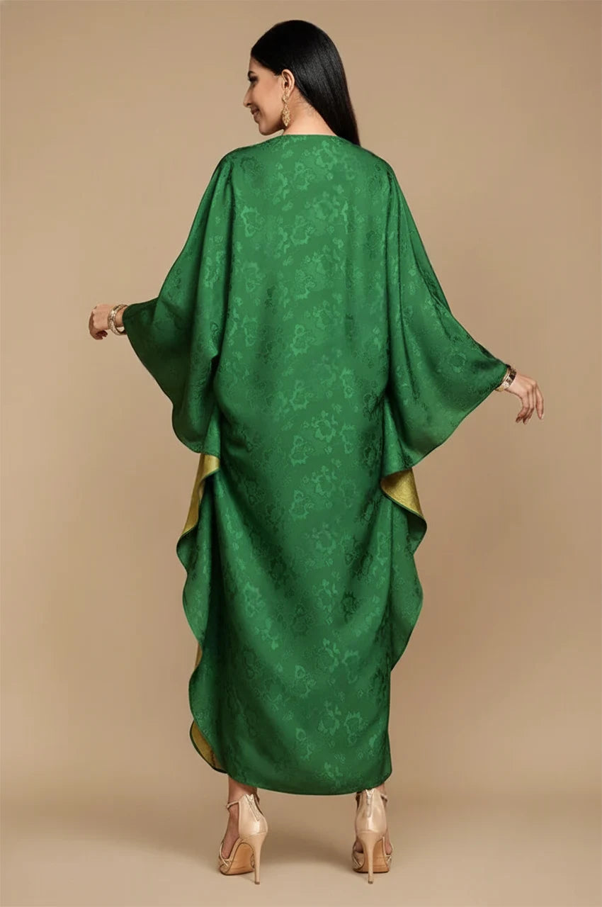 Draped back view of Selora green embellished silk kaftan showing layered silk flow and gold lining