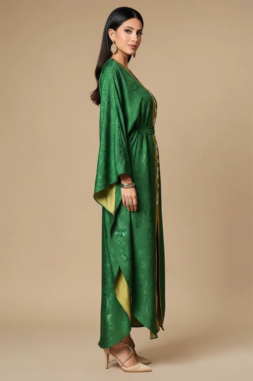 Side view of Selora green embellished silk kaftan with flowing silk drape and gold contrast panel
