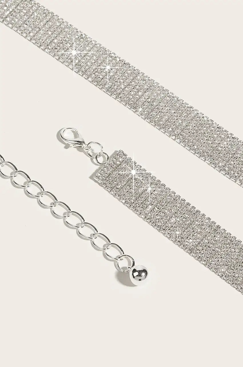 Close-up of the silver metal chain extender and clasp on the rhinestone belt.