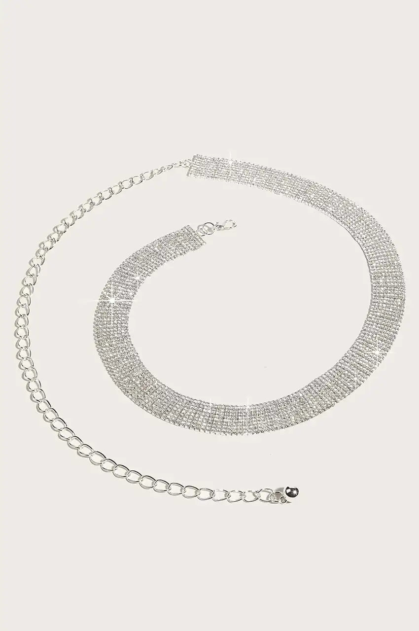 Close-up of the silver metal chain extender and clasp on the rhinestone belt.