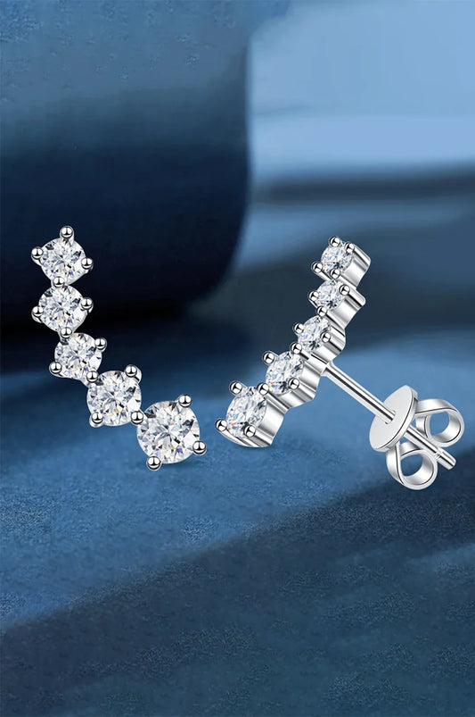 Side profile of crystal ear crawlers showing prong setting and butterfly back closure.