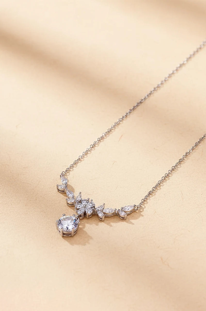 Silver floral vine cubic zirconia necklace on beige background for Kaftan accessories