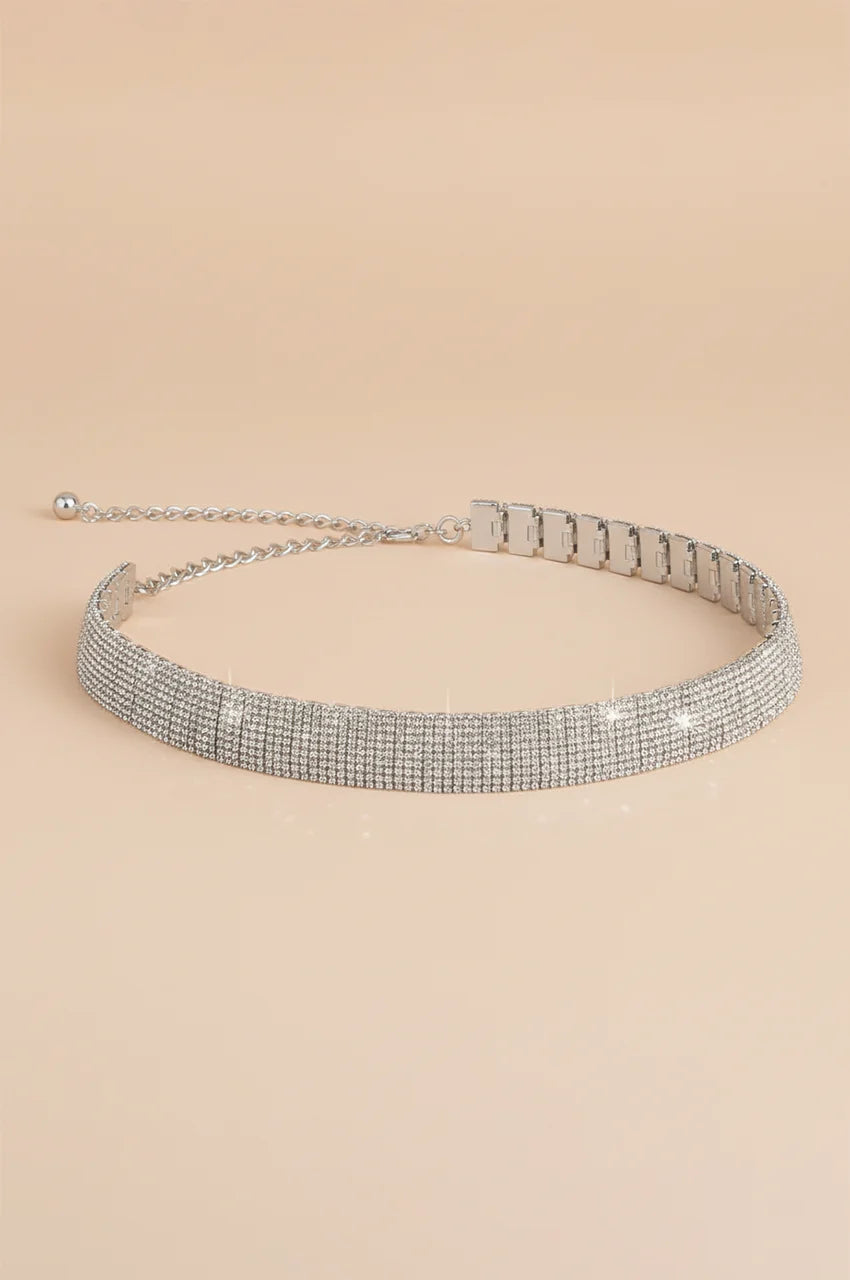 Angled shot of silver crystal waist belt highlighting the thickness and sparkle.