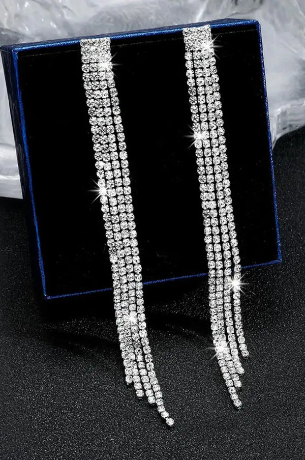 Silver waterfall drop earrings displayed in a blue jewelry gift box.