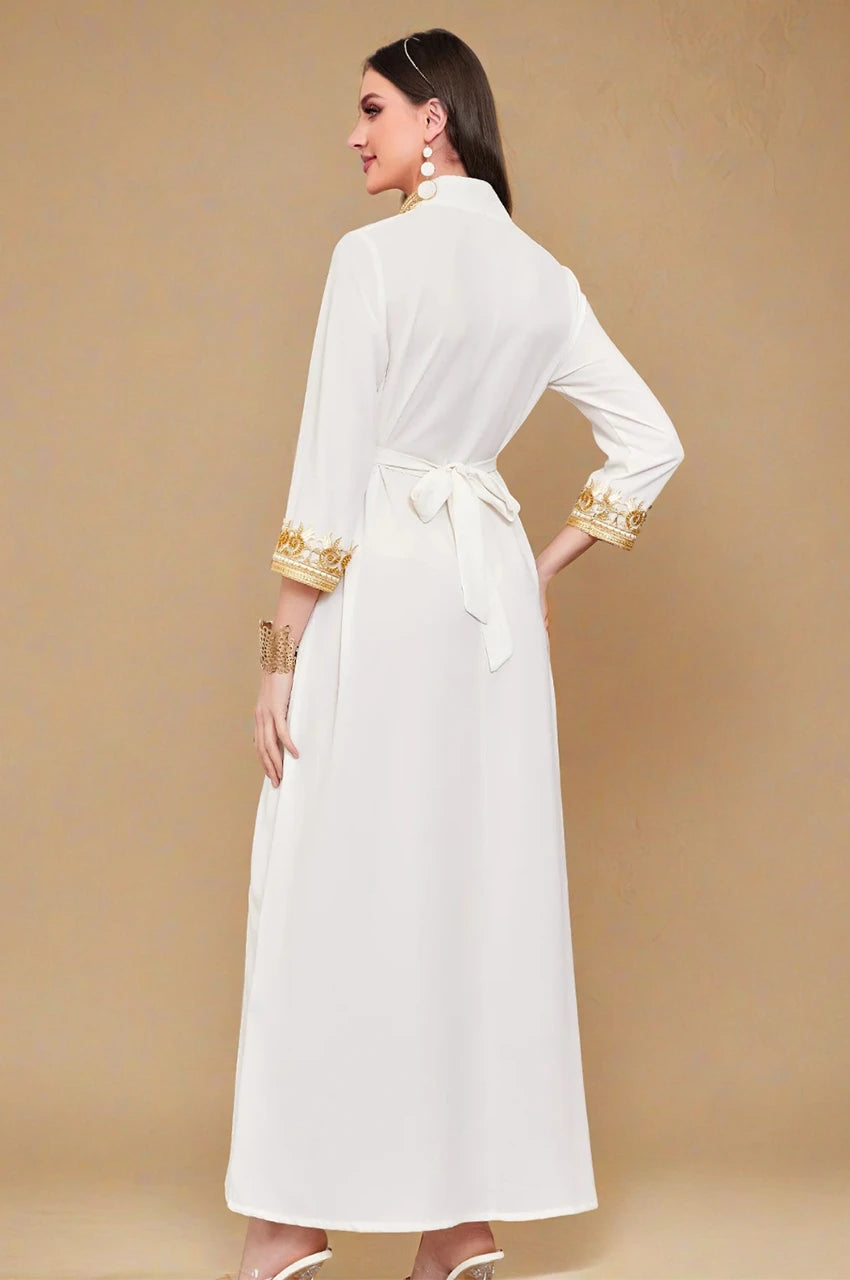 Back view showing the Mdamma belt closure on the white and gold chiffon kaftan dress.