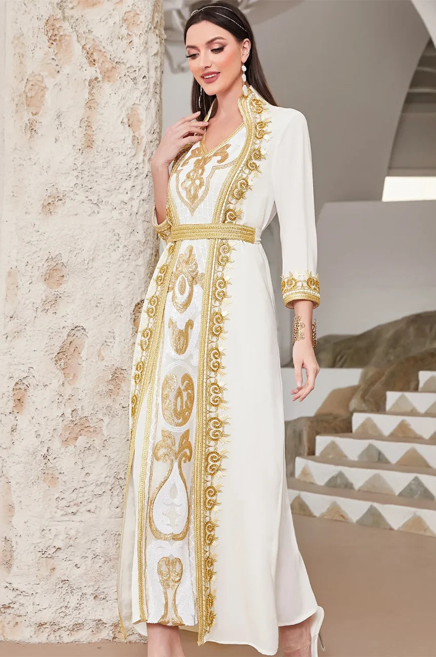 Walking pose highlighting the movement of the 2-piece white chiffon kaftan dress.