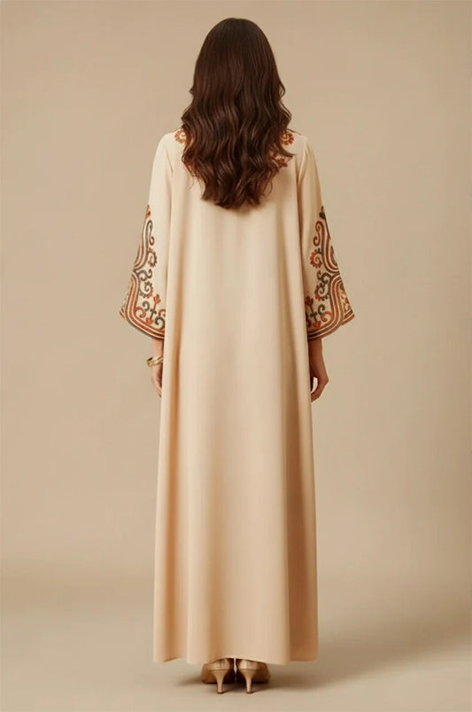 Back view of Soraya beige modern Moroccan kaftan with embroidered sleeves and long elegant hemline