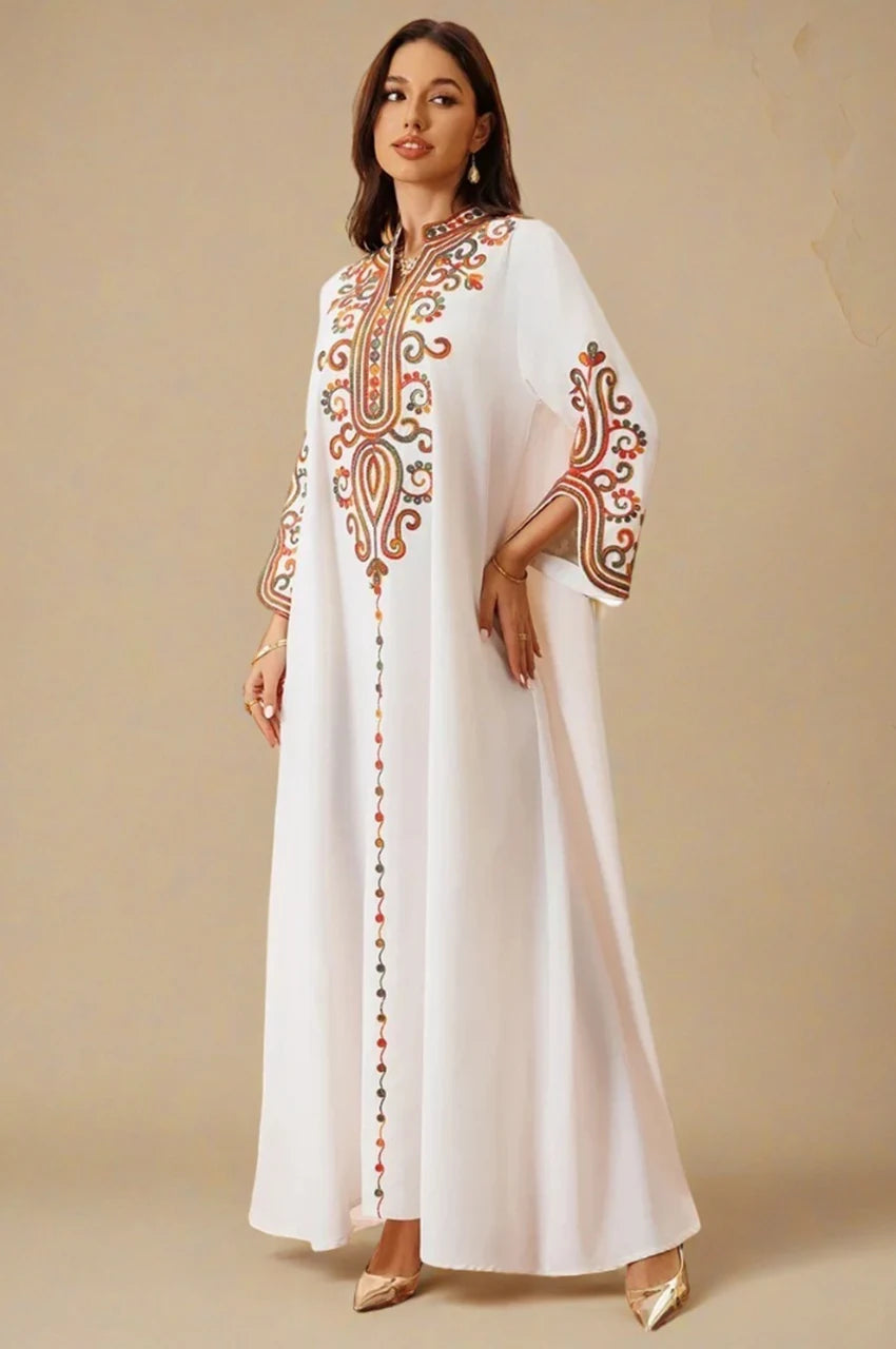 White modern Moroccan kaftan Soraya with multicolor embroidery – angled front