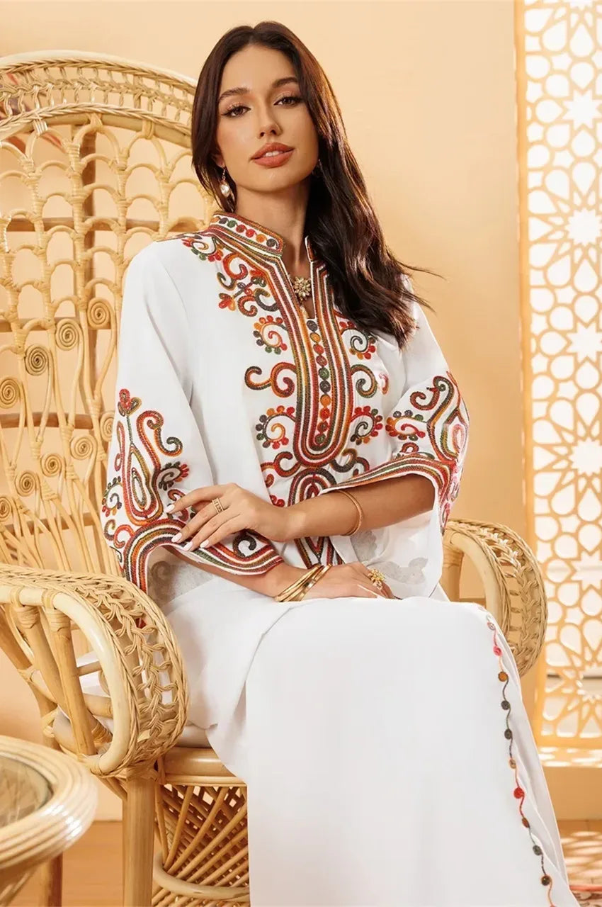 Soraya white embroidered Moroccan kaftan styled in a luxury oriental-inspired interior