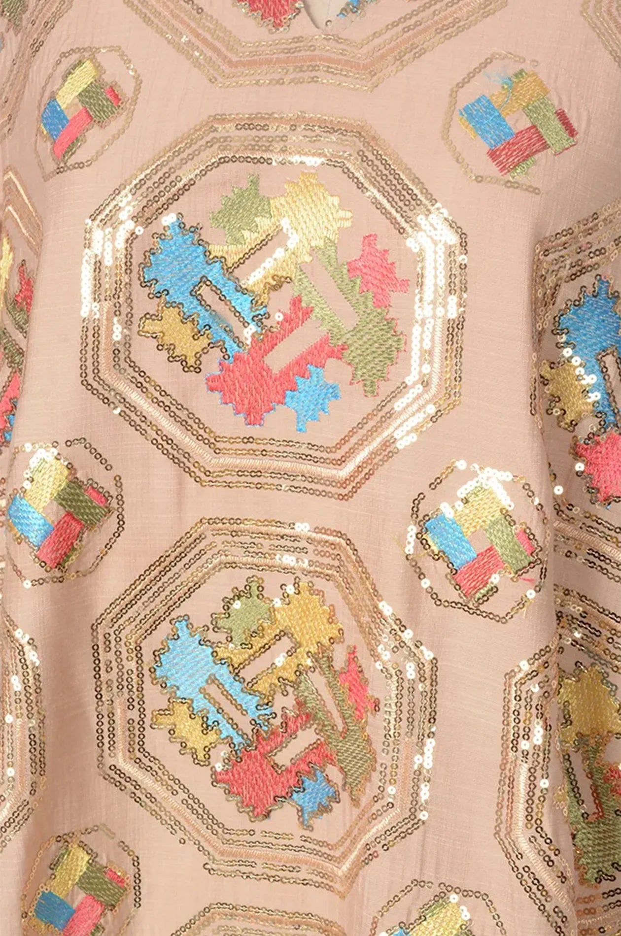 Macro detail of the gold sequin and octagonal geometric embroidery on the Sorin beige mandarin collar kaftan.