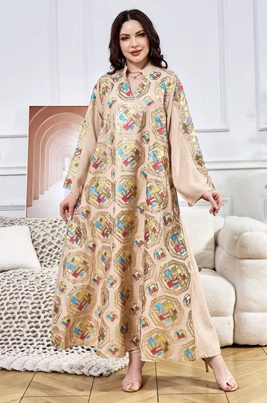 Full-length lifestyle view of the beige Sorin kaftan by Naylara, highlighting the elegant movement of the fabric.