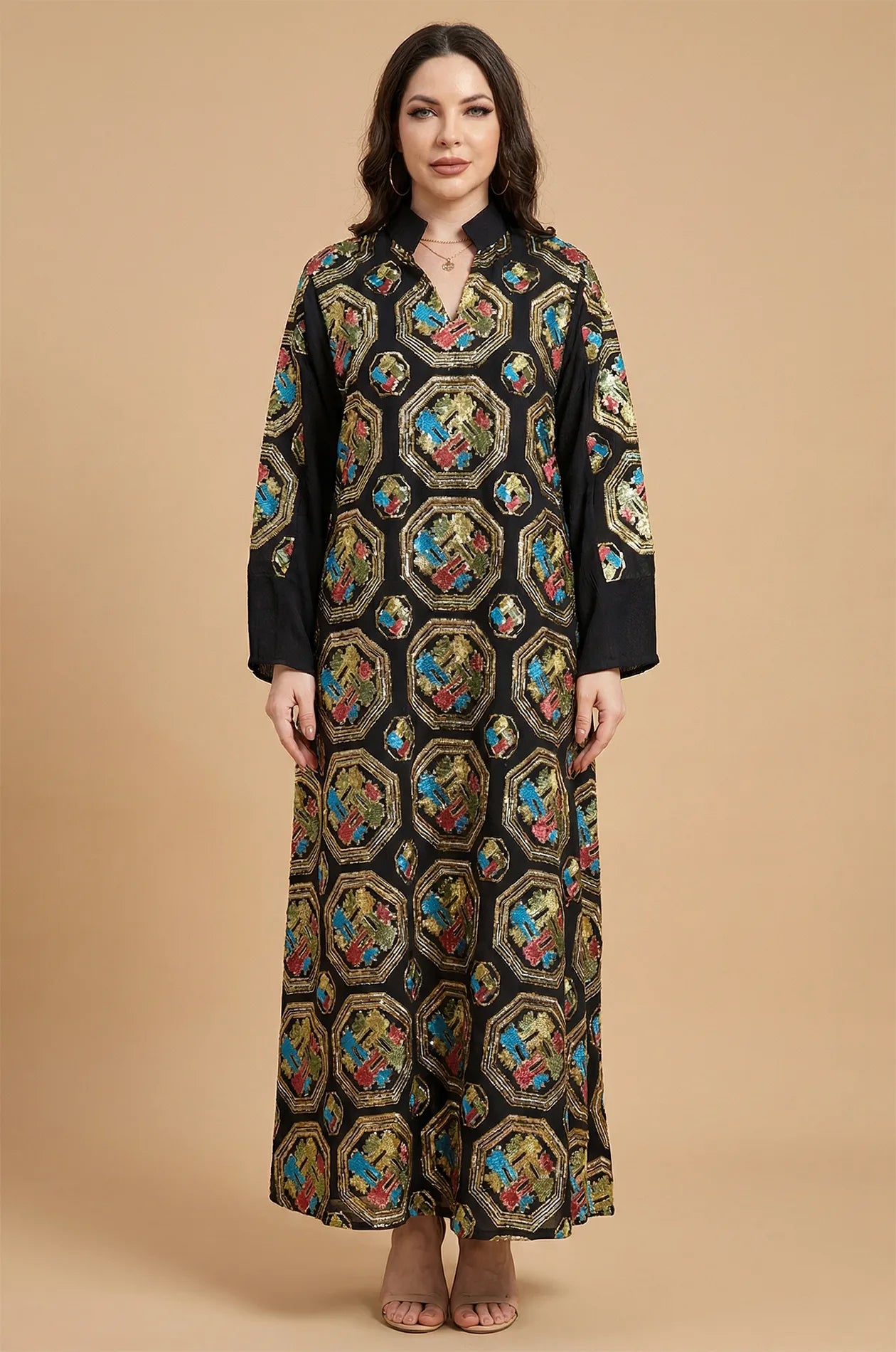 Front studio portrait of the Sorin black mandarin collar kaftan, displaying the all-over ornate sequin embellishments.