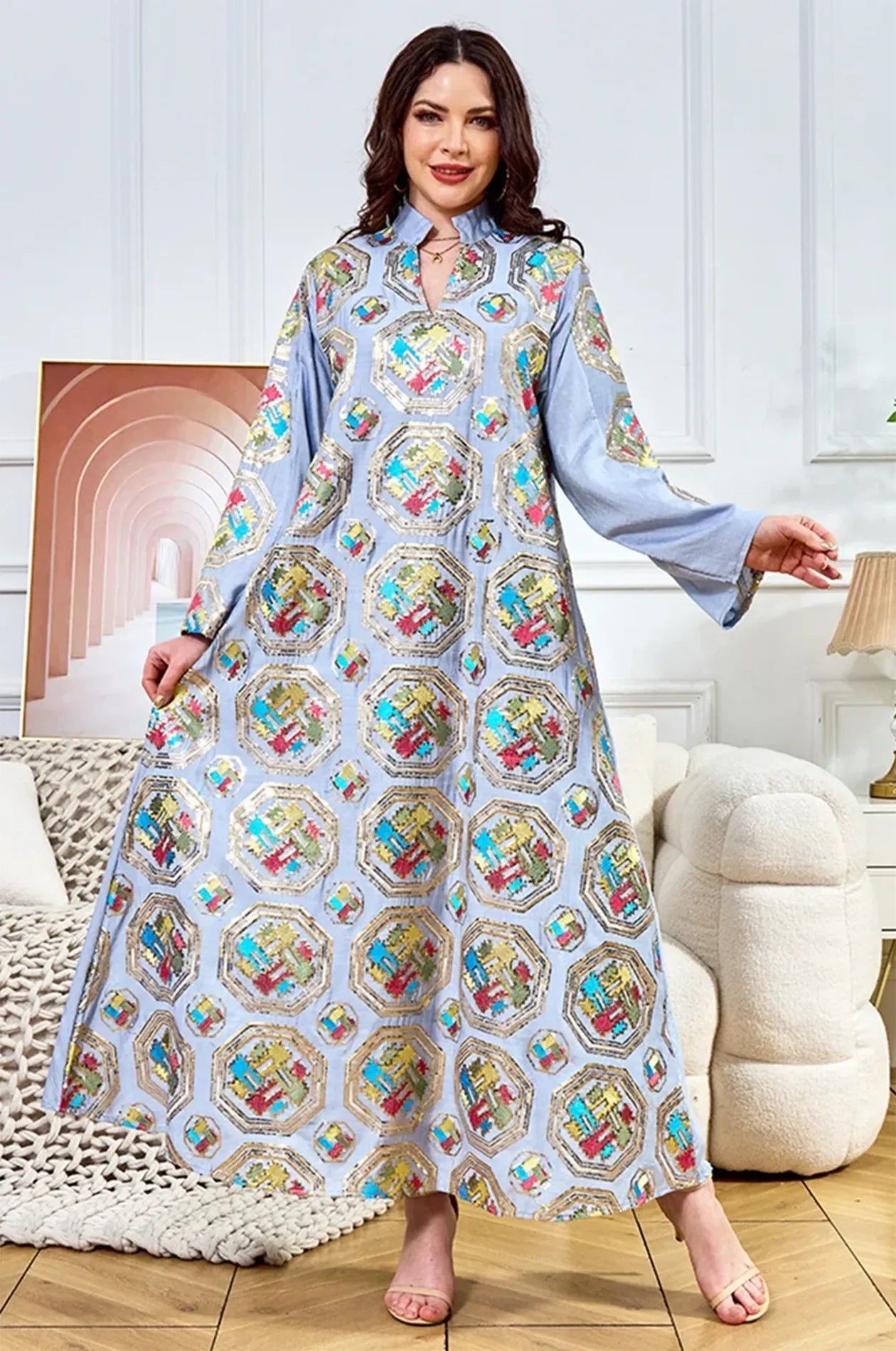 Full-length front view of the Sorin light blue sequin kaftan with a mandarin collar in a luxury indoor setting.