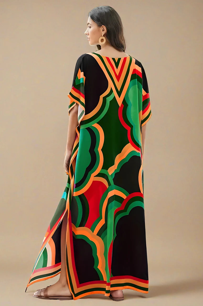 Back view of green printed kaftan dress with wide sleeves and loose fit