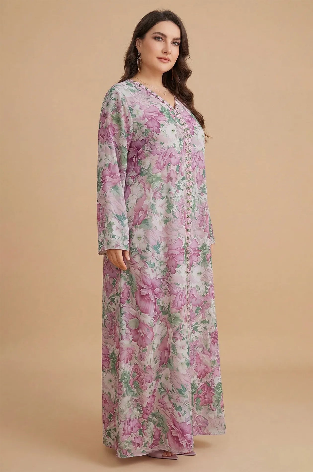 Three-quarter side view of the Suri pink kaftan highlighting the sleeve length and drape.