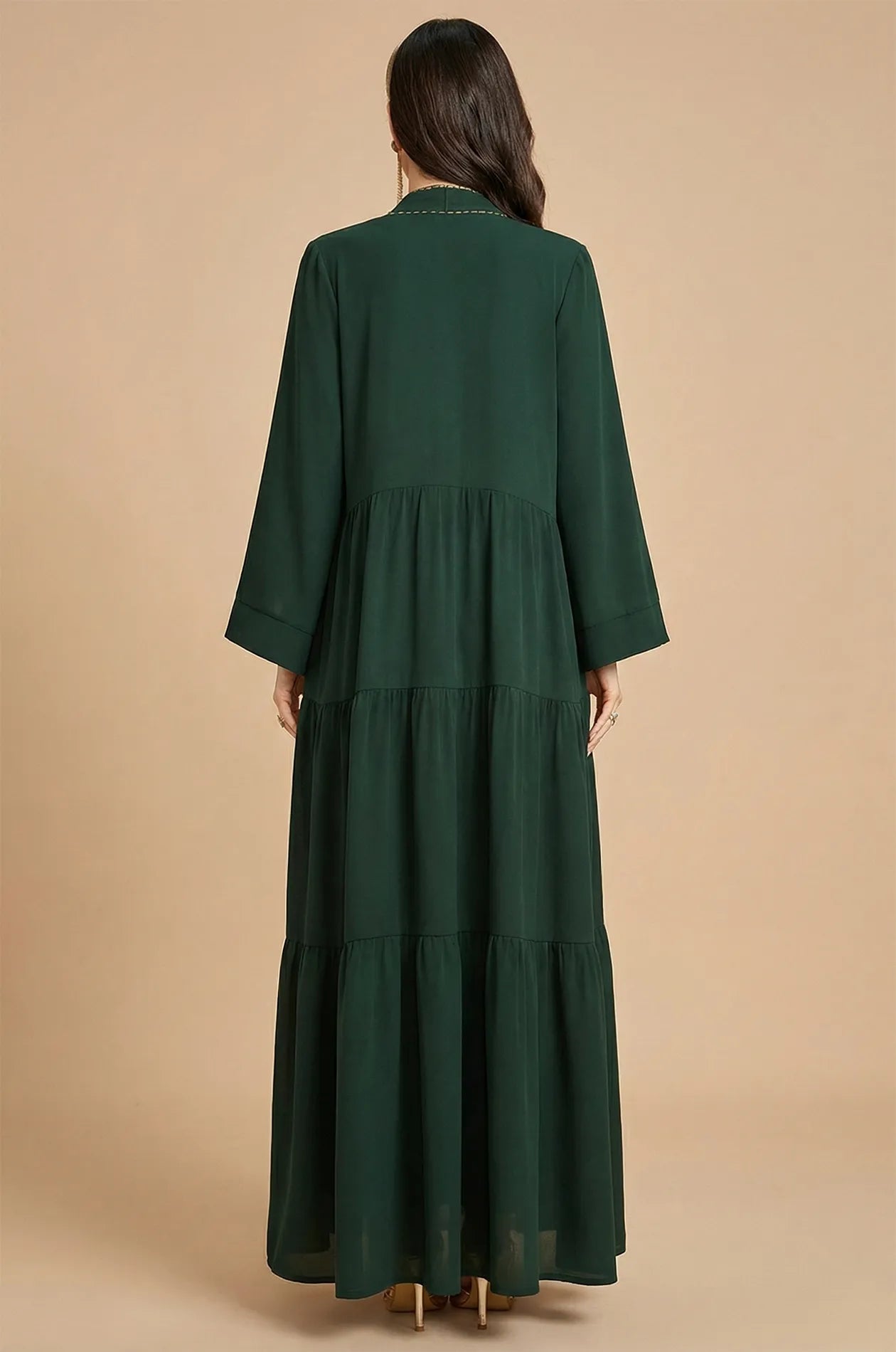Back view showing the tiered layers of the forest green Thais kaftan.