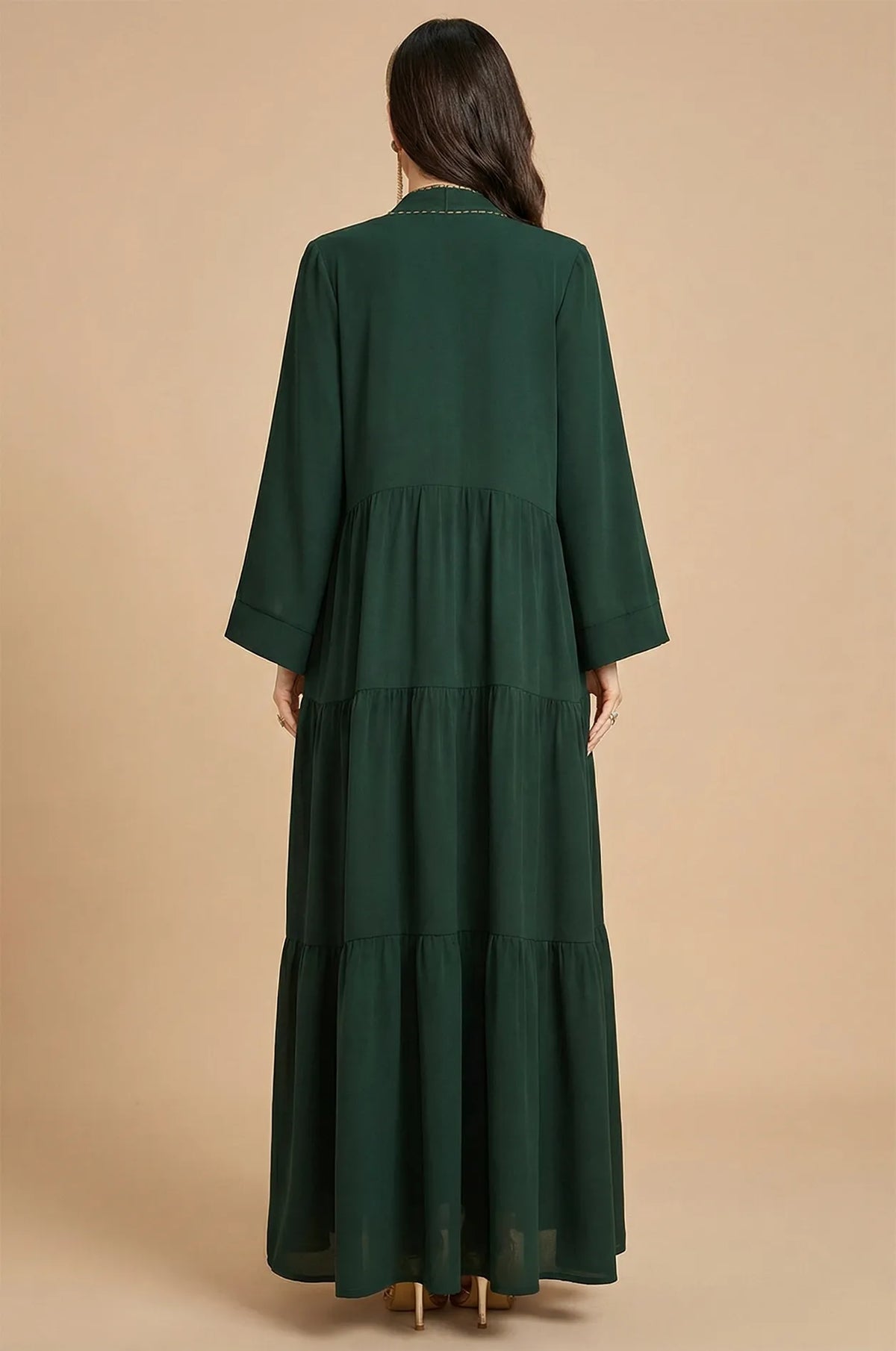 Back view showing the tiered layers of the forest green Thais kaftan.