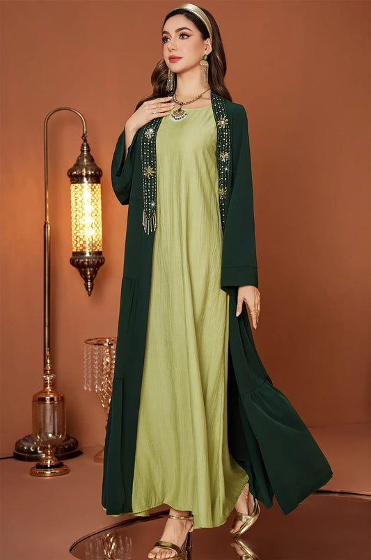 Full body shot of the Thais kaftan in a warm luxury interior setting.
