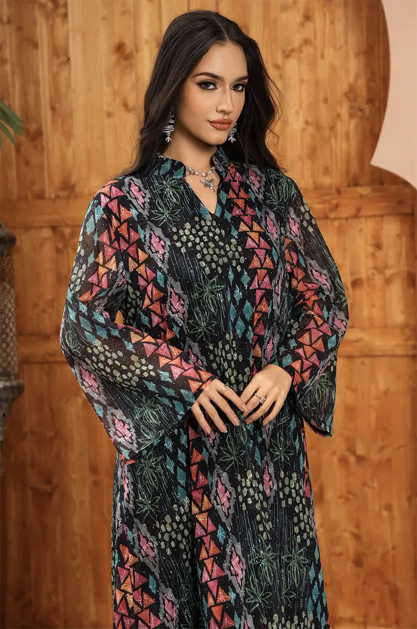 Detailed upper-body shot of the Tyrah black geometric print kaftan showing the vibrant pattern density.