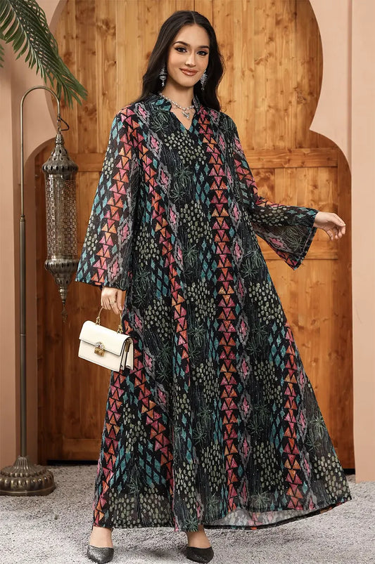 Styling inspiration for the Tyrah black geometric print kaftan paired with a white pearl clutch.