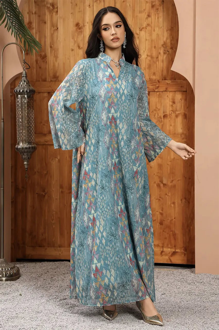 Full-length shot of the Tyrah light blue geometric print kaftan with dramatic bell sleeves.