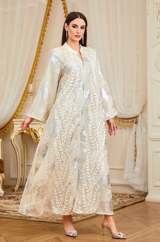 Elegant pose featuring the Veris silver embroidered white kaftan for wedding attire.