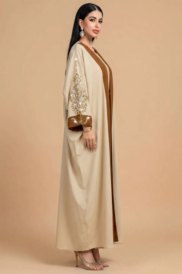 Side profile of the Vetta butterfly sleeve kaftan in khaki and brown.