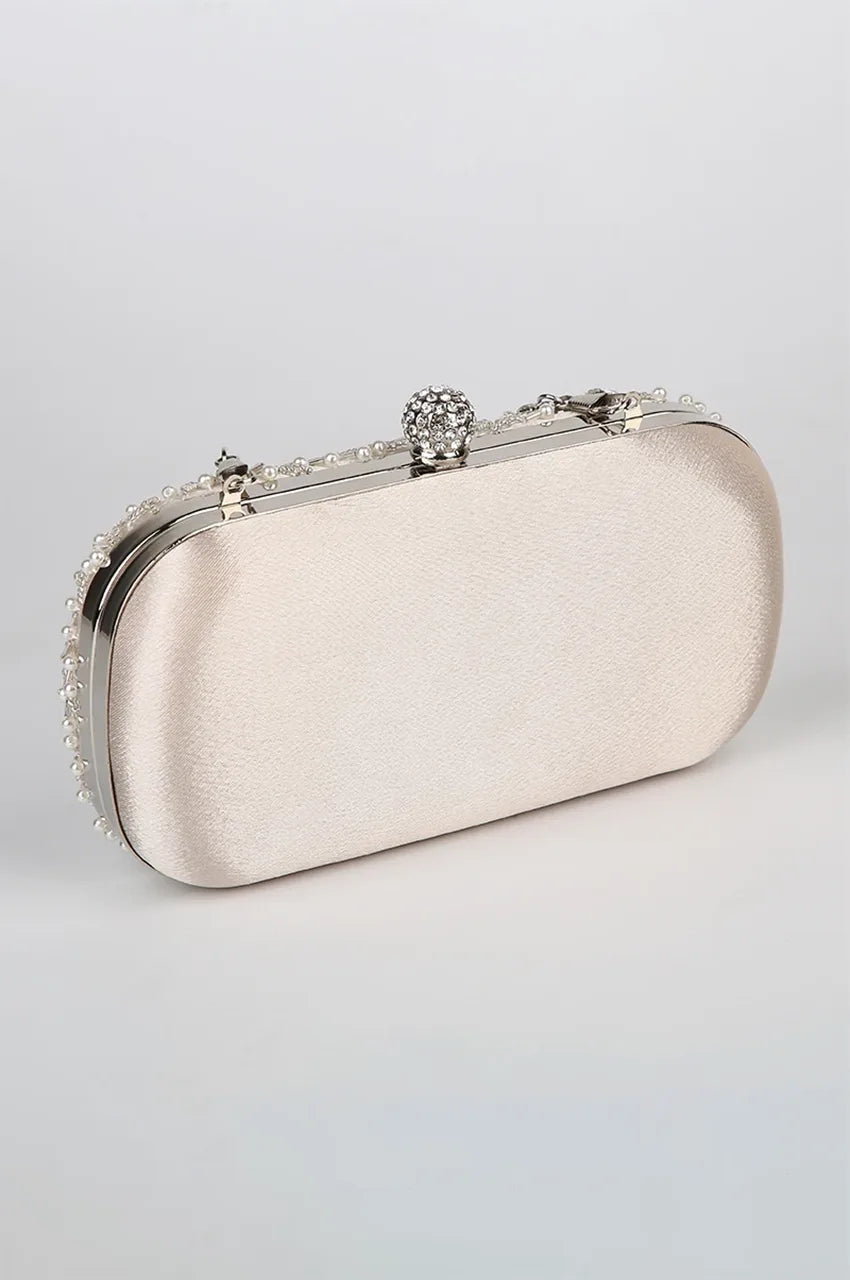 Back view of white satin evening bag showing smooth snag-free fabric finish and polished silver metal hardware.