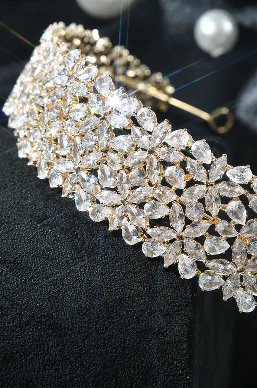 Close-up of the Wide Gold-Tone Floral Headband, highlighting the brilliance and floral pattern detail.
