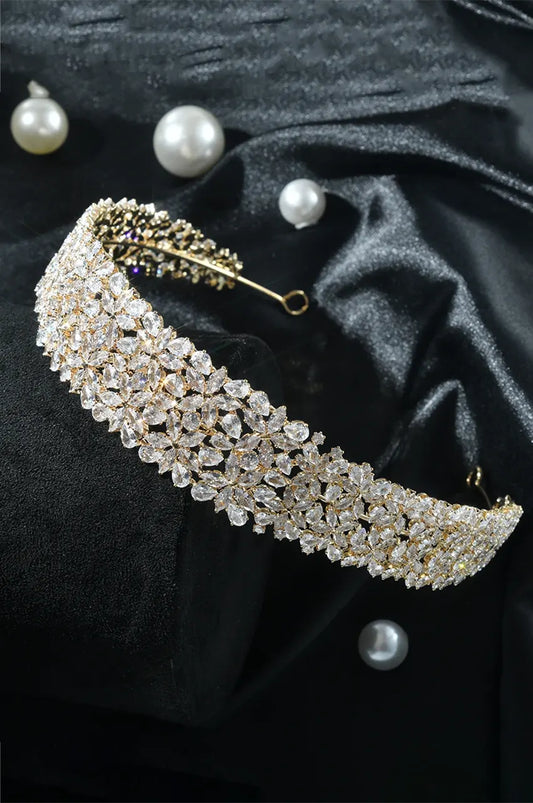Wide Gold-Tone CZ Tiara Headband with continuous floral pattern displayed on black satin with pearls.