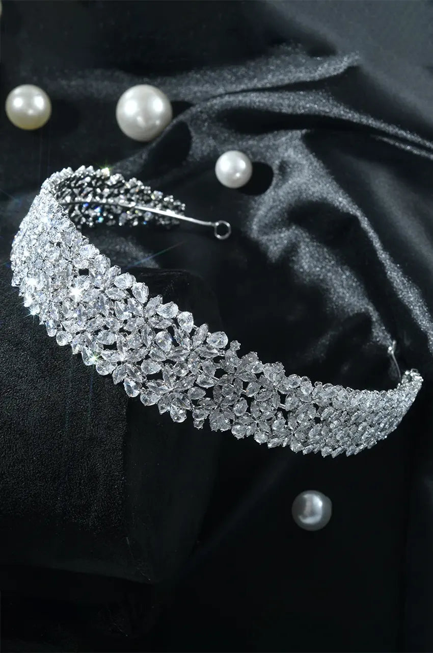 Wide Silver-Tone CZ Tiara Headband with continuous floral pattern displayed on black satin with pearls.
