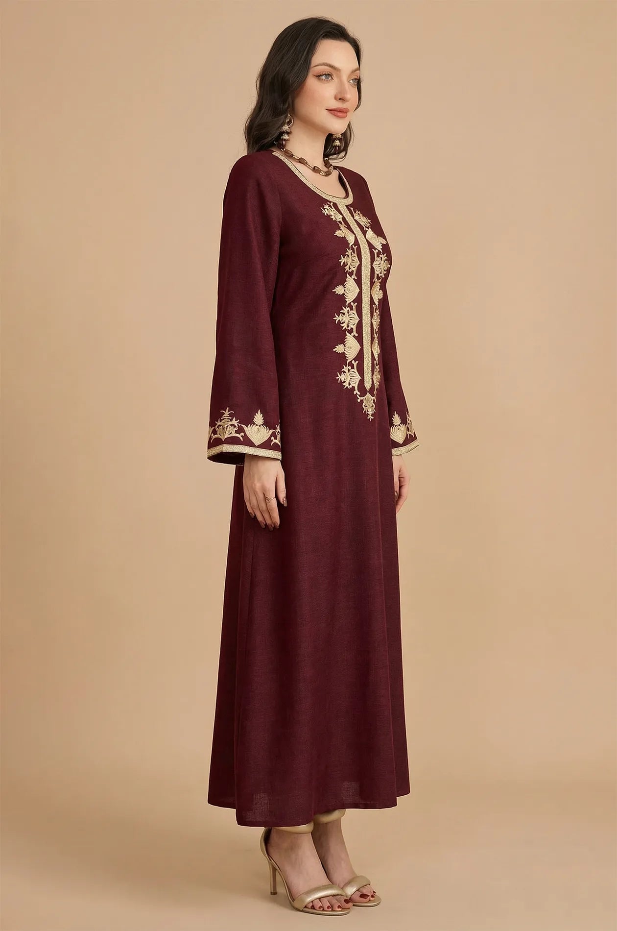 Side profile of the Lelia maroon caftan showing sleeve detail