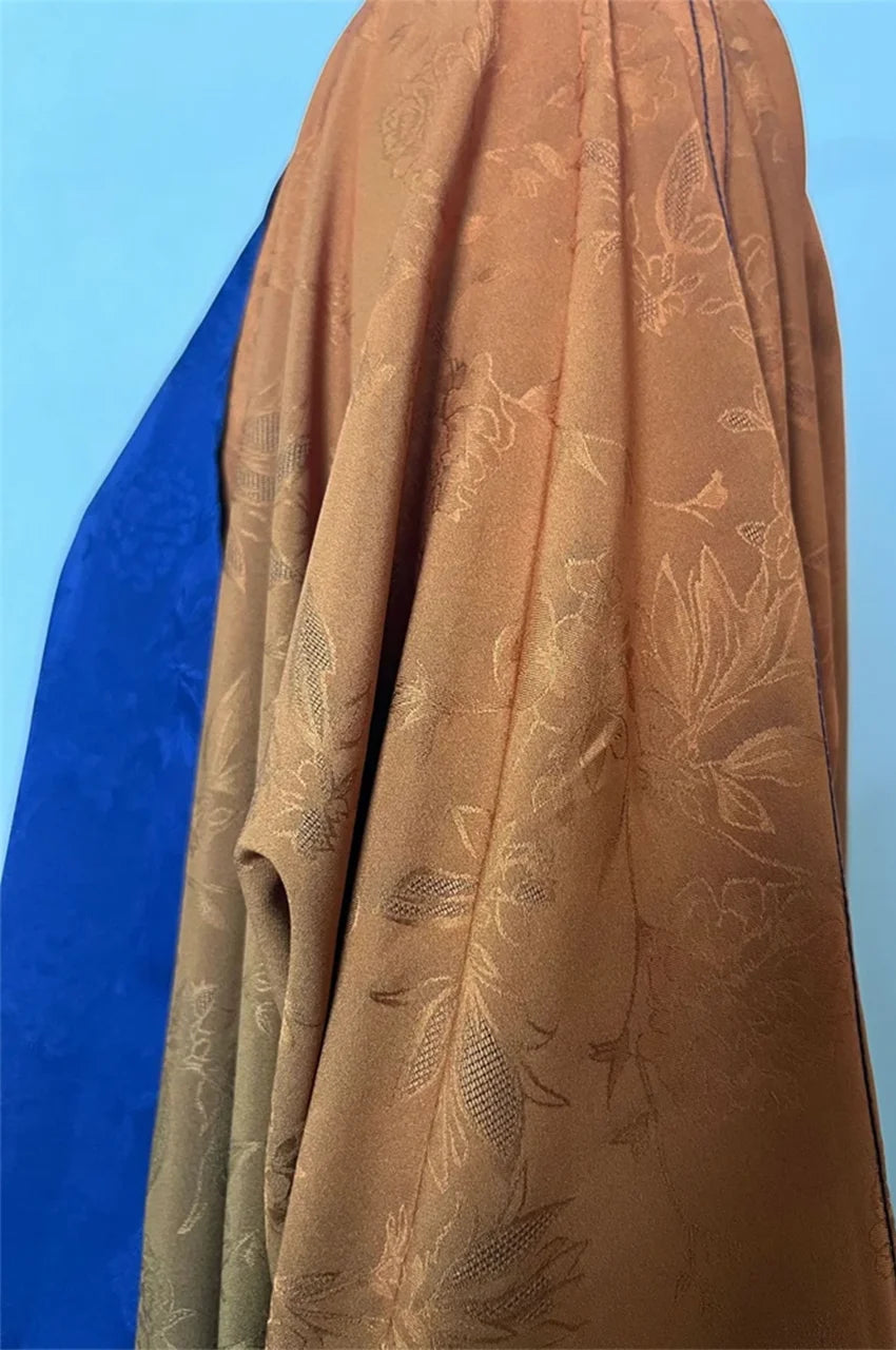 Fabric detail of jacquard floral pattern on ombre kimono kaftan