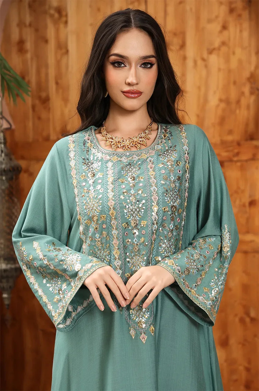 Detailed view of the ornate Sfifa borders and heavy embroidery on the flared sleeves of the Zahia Green Kaftan.