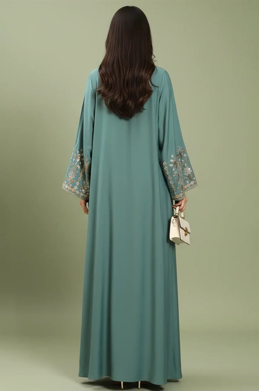 Back view of the Zahia Green Saudi Kaftan showing the modest floor-length drape and elegant fit.