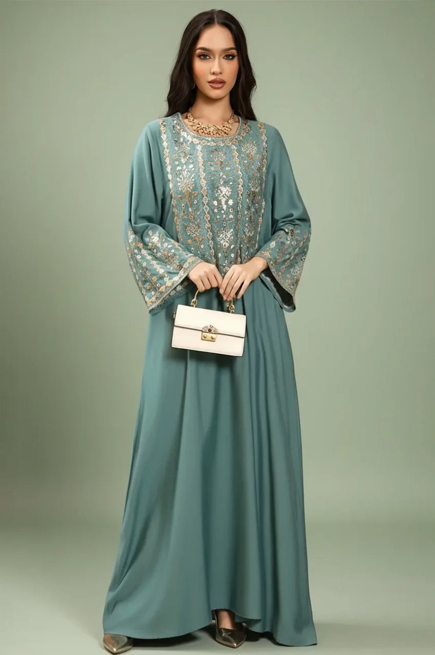 Front view of the Zahia Green Saudi Kaftan with intricate metallic embroidery and a fluid silhouette.