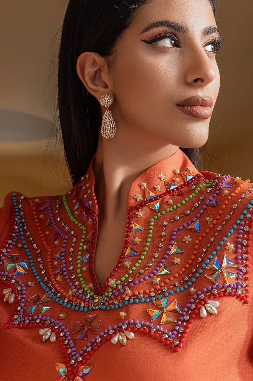 Close-up of colorful beaded neckline on Zahra orange kaftan dress