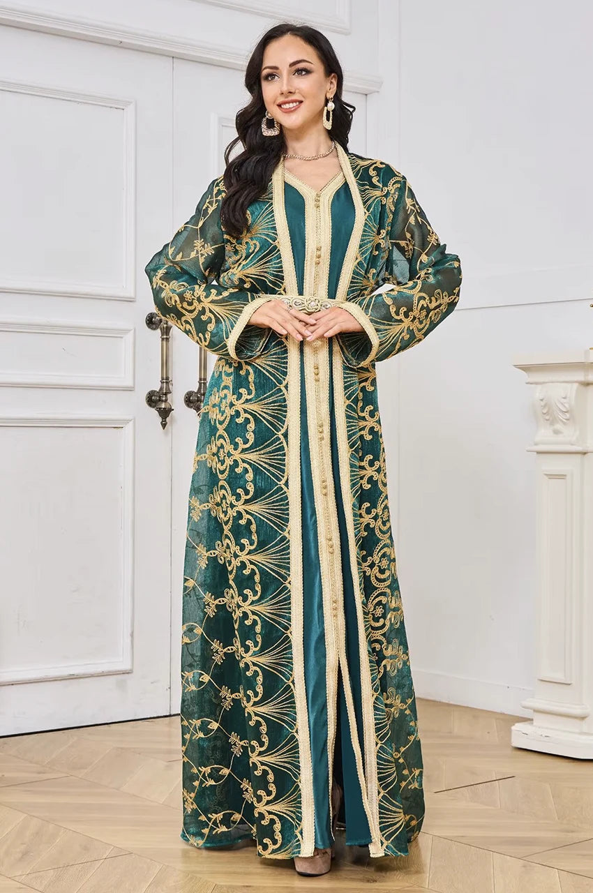 Detail shot of the intricate gold floral embroidery and Sfifa trimmings on the green kaftan.