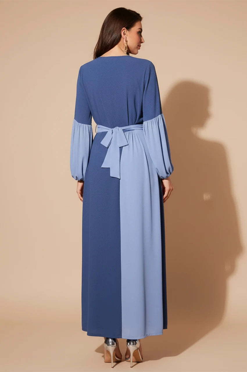 Back view of Zaria dress showing two-tone blue color blocking and belt tie.