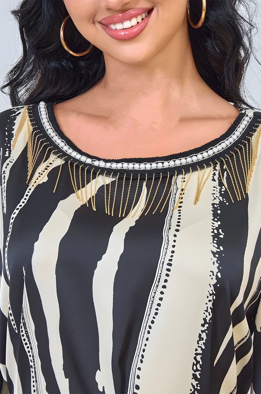 Gold chain neckline and pearl beading on Zayla black and white kaftan