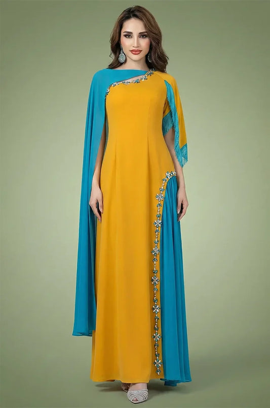 Full-length front view of Zayna mustard yellow and teal blue kaftan cape with rhinestone detailing.