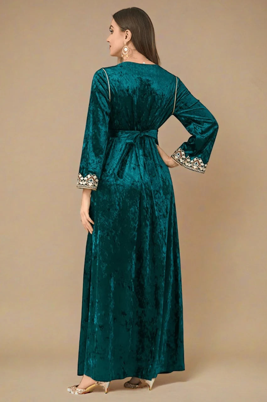 Zaynah dark green Moroccan velvet kaftan angled back shot with embroidered sleeves